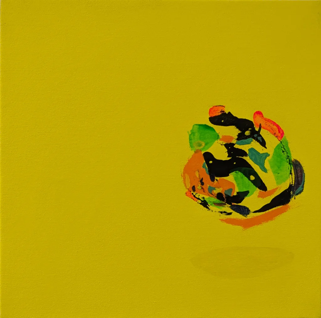 Almost the entire canvas is a flat, even yellow — and then, right of center, a compact knot of paint: black, orange,